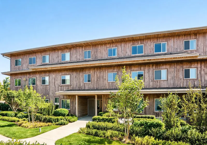 Multifamily exterior with woodgrain cladding